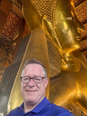 Me next to the reclining Buddha