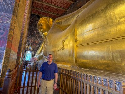 Me next to the reclining Buddha